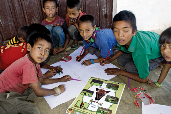 Children of Mimi village in Nagaland draw bats as part of BCITs outreach activities.