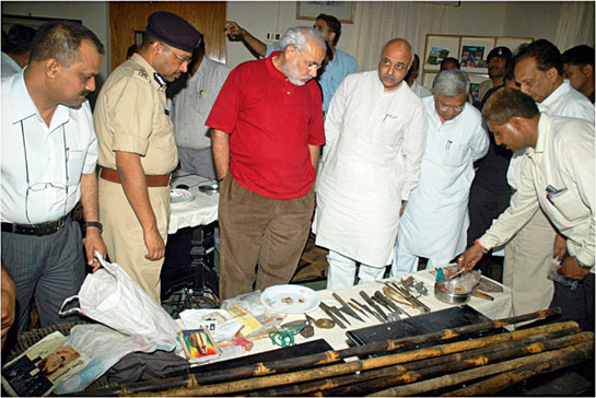 A file picture of Narendra Modi with police officials inspecting the tools of trade of poaching syndicates that had gone on a macabre lion-killing spree in the Gir Wildlife Sanctuary in 2008. The gang was busted and convictions were won. His support for lion conservation has helped the species recover and the hope now is that his massive mandate be put to work to secure the future of the tiger and other habitats and species across India.