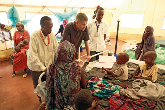 Solheim visits victims of the hunger disaster at a refugee camp in Dadaab, Kenya.