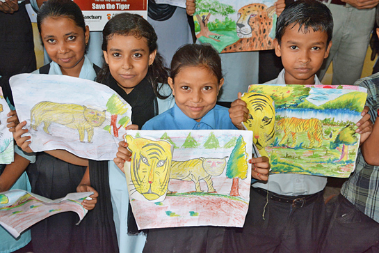 Students of Karara Higher Secondary School in Baihata showcase their artwork during a Kids for Tigers programme organised by WildRoots.